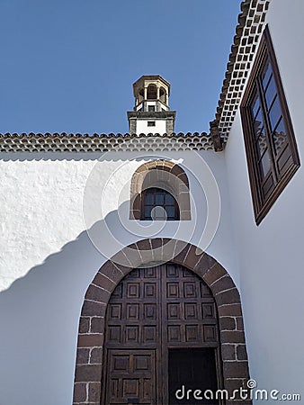 Catholic Church of Immaculate Conception. Perspective and underside view of parish entrance with tall tower Stock Photo