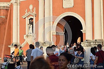 Catholic devotees coming out from cathedral portal during Good Friday, as part of Holy Week celebrations Editorial Stock Photo