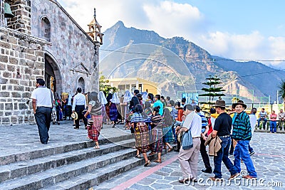 Catholic locals enter church for New Year`s Eve mass, San Juan la Laguna, Lake Atitlan, Guatemala Editorial Stock Photo