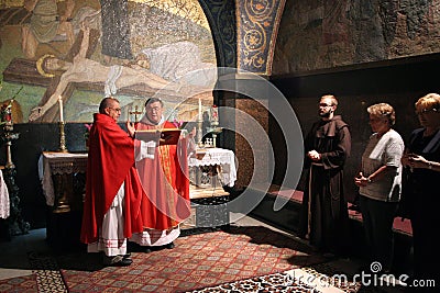 Catholic Mass at the 11th Stations of the Cross in the Church of the Holy Sepulchre in Jerusalem Editorial Stock Photo