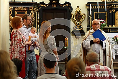 Baptism of little kid Editorial Stock Photo