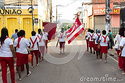 Catholic priest and faithful are seen during the procession of the Passion of Christ in the streets Editorial Stock Photo