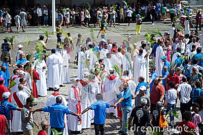 Catholic priests and faithful are seen during the Palm Sunday procession Editorial Stock Photo
