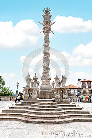 Romanesque Pillory or Obelisk in Porto Cathedral Catholic square. Oporto Portugal. Editorial Stock Photo