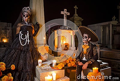 Mexican Catrina and Catrin at a cementery Editorial Stock Photo