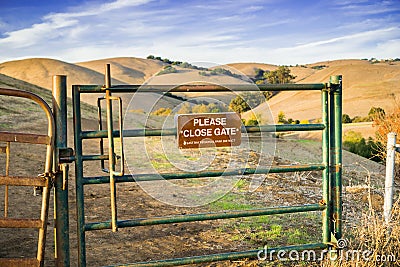 Cattle gate on one of the hiking trails in Garin Dry creek Pioneer Regional Park in east San Francisco bay, California Stock Photo