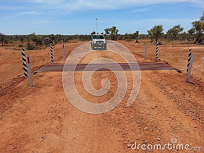 Cattle grid on gravel road in Australian Outback Stock Photo