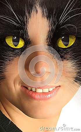 Catwoman with brightly yellow eyes Stock Photo