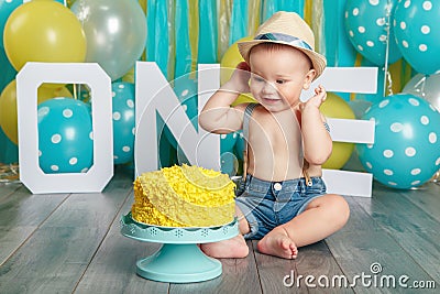 Caucasian baby boy celebrating his first birthday. Cake smash Stock Photo