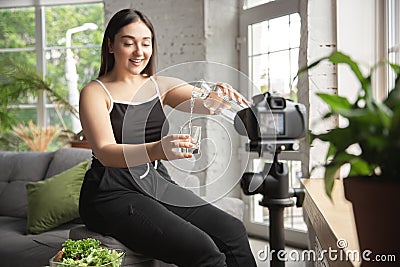 Caucasian blogger woman make vlog how to diet and lost weight. Lifestyle, influencer women, healthy concept. Stock Photo