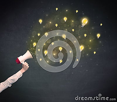 Businessman hold a megaphone with lightbulbs Stock Photo