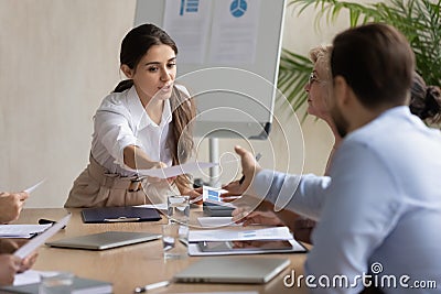Caucasian businesswoman share handout material at meting Stock Photo