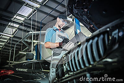 Performing Car Maintenance Stock Photo