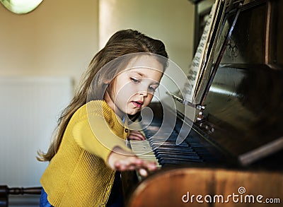 Caucasian children playing piano concept Stock Photo