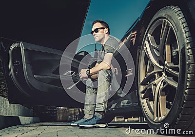 Caucasian Driver Seating Inside His Modern Exotic Sporty Car Stock Photo