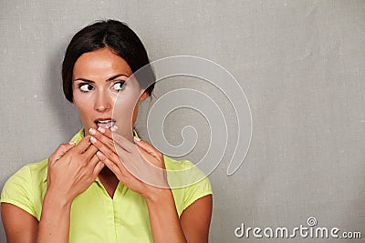 Caucasian ethnicity woman with hands to mouth Stock Photo