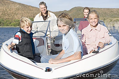 Caucasian Family Of Five In Speedboat Stock Photo