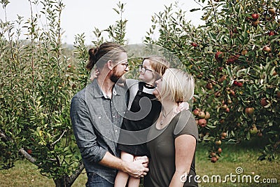 A Caucasian family is spending time at the farm together Stock Photo