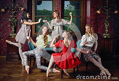 Caucasian fashion cheerful ballerinas in a pose drinking tea Stock Photo