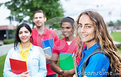 Caucasian female student with group of multiethnic students Stock Photo