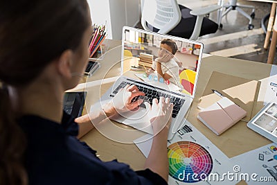 Caucasian female teacher using laptop on video call with schoolboy Stock Photo