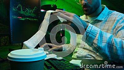 Caucasian focused man programmer checking coding guy coder male professional digital engineer IT support drinking coffee Stock Photo