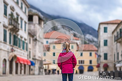 Girl standing on the Kotor Old Town main square Stock Photo