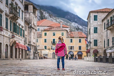 Girl standing on the Kotor Old Town main square Stock Photo