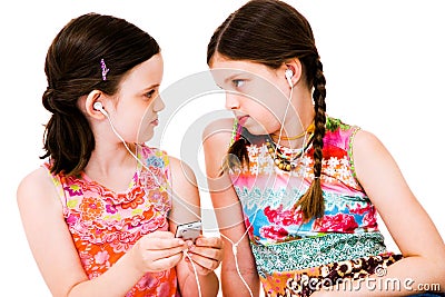 Caucasian girls listening MP3 Stock Photo