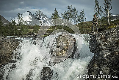 Caucasian Hiker Exploring Scenic Norwegian Waterfalls Stock Photo