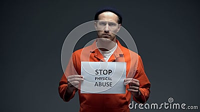 Caucasian imprisoned prisoner stop physical abuse sign sexual harassment in jail Stock Photo