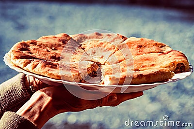 Caucasian khychin bread pie with meat close Stock Photo