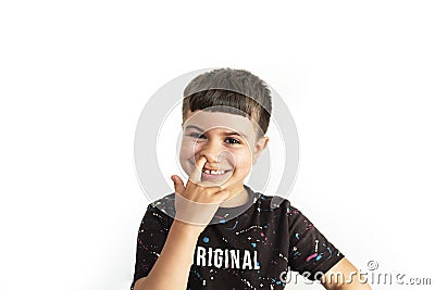 Caucasian kid making a finger-in-the-nose gesture on white background Stock Photo