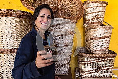 Caucasian Latin artisan taking Argentinian matte at work Stock Photo