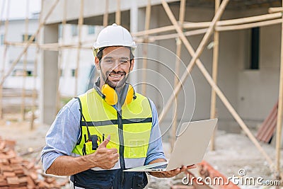 Caucasian latin worker foreman home builder hand sign thumbs up for good pass build and safety quality confirm concept Stock Photo