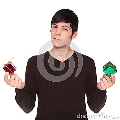 Caucasian man comparing green present to red Stock Photo
