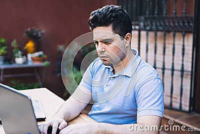 Caucasian man with a concentrated expression trading cryptocurrencies Stock Photo