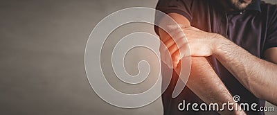 Caucasian man with elbow pain. Pain relief concept Stock Photo