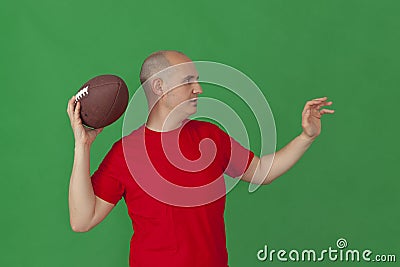 Caucasian man imitating a quarterback Stock Photo