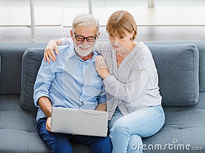 Caucasian old senior elderly lovely lover grandparents romantic couple gray hair and bearded husband and wife sitting smiling Stock Photo