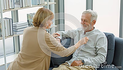 Caucasian old senior elderly supportive wife sitting use stethoscope testing listening heartbeat from unhealthy gray bearded and Stock Photo