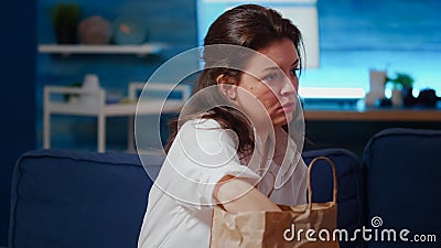 Caucasian person removing face mask after getting takeout meal Stock Photo