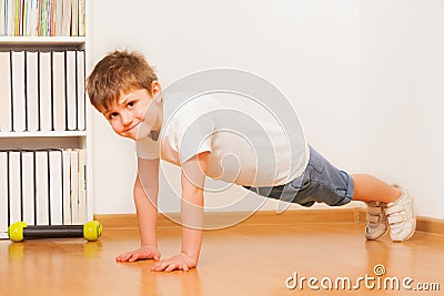 Caucasian preschooler boy making gymnastics Stock Photo