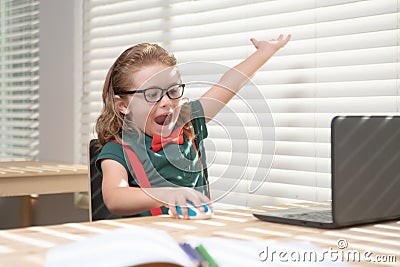 Caucasian school boy have video call distant class with teacher using laptop, happy small child wave greeting with tutor Stock Photo