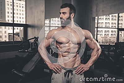 Caucasian fitness model in gym close up abs Stock Photo