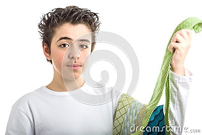 Caucasian smooth-skinned boy holding extravagant green ties Stock Photo