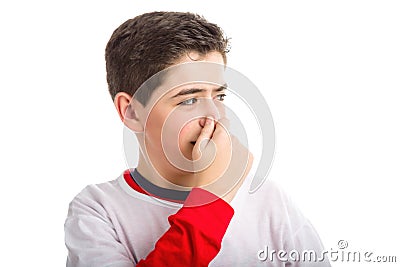 Caucasian smooth-skinned boy plugging his nose Stock Photo