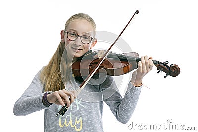 Caucasian teenage girl wears glasses and plays the violin Stock Photo