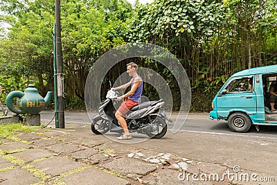 Caucasian tourist on motorbike Editorial Stock Photo