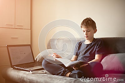 Caucasian white boy doing his homework Stock Photo